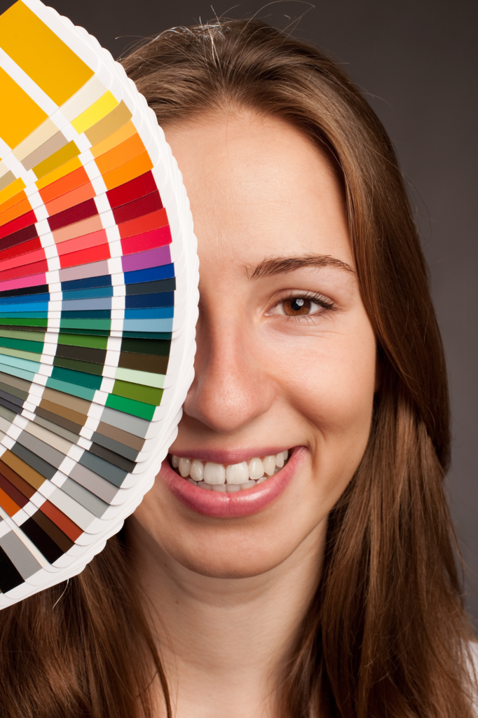 vegas-print-school-student-holding-a-pantone-color-chart-up-to-her-eye